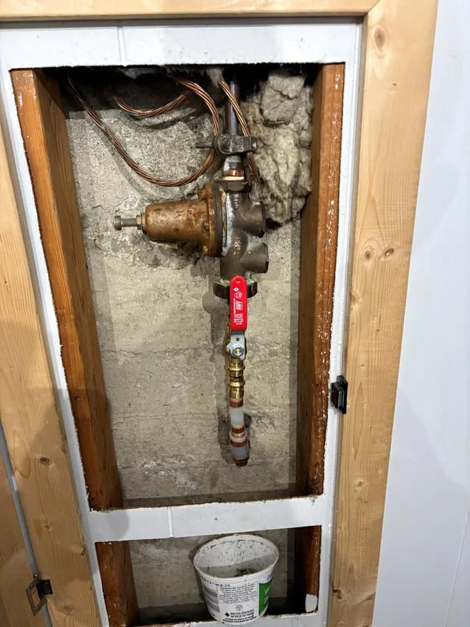 The new main shutoff valve fitted in the wall